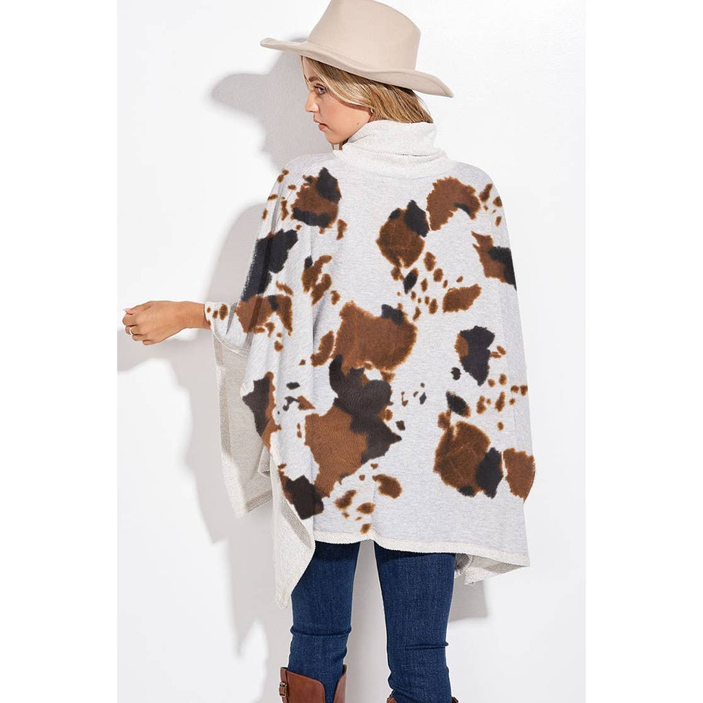 Cow print turtle neck poncho