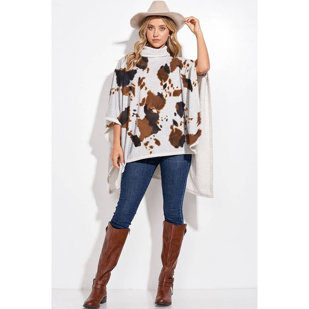 Cow print turtle neck poncho