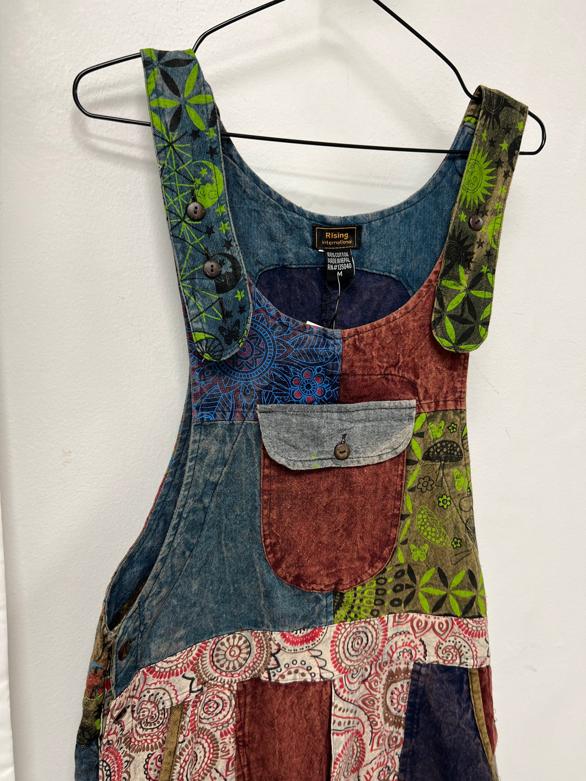 Patchwork jumpsuit front pocket and button strap details